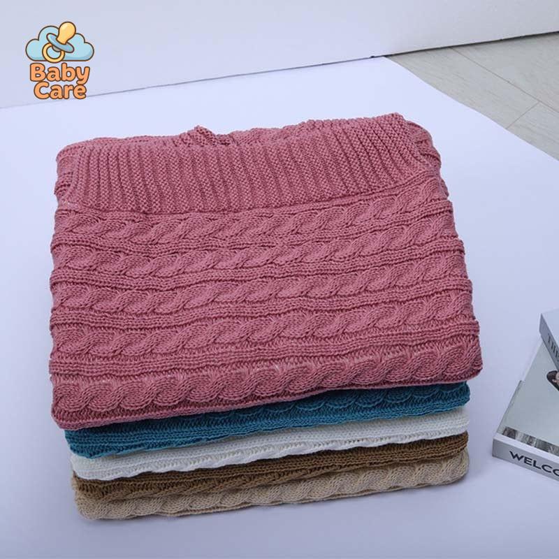 Nid d'ange bébé tricot à boutons - zoom sur la matière